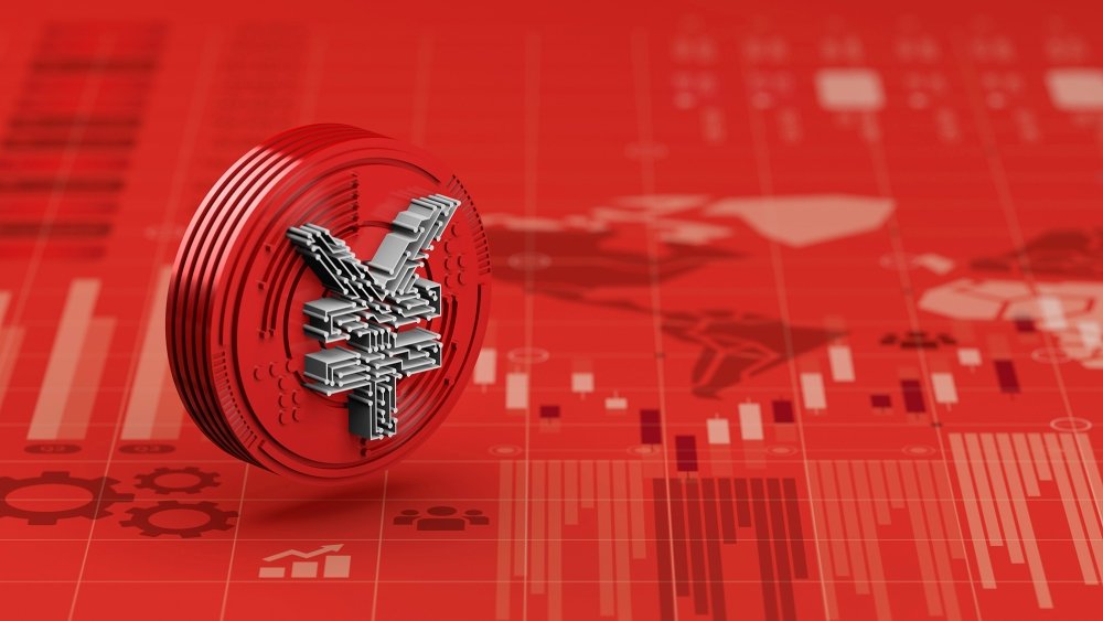 A red coin with a silver yuan sits on a red economic chart