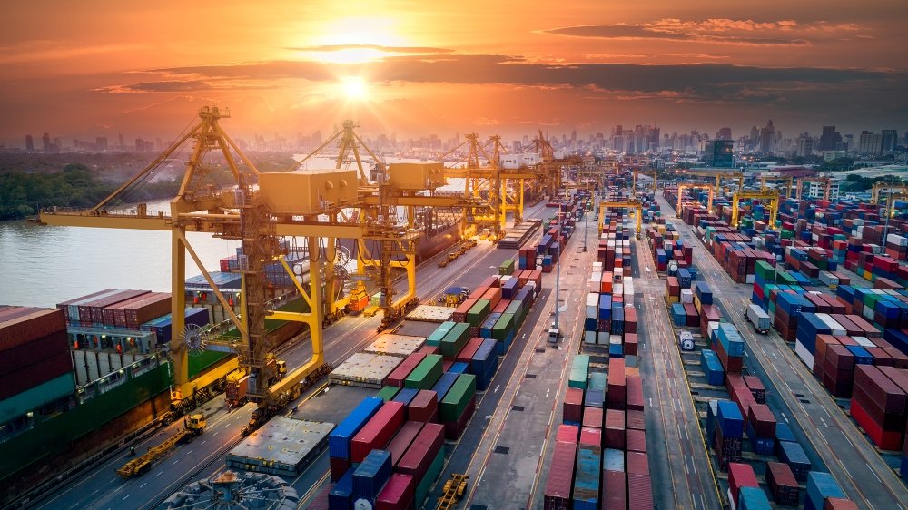 An image of a shipping port unloading containers.