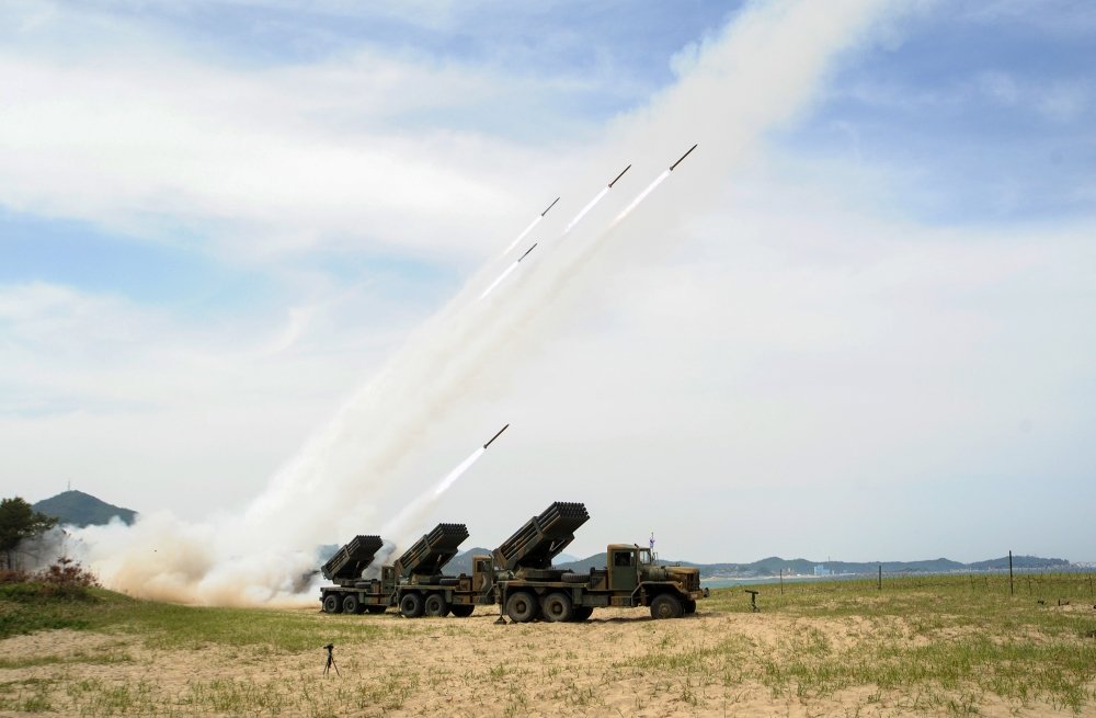 South Korean army units firing rockets.