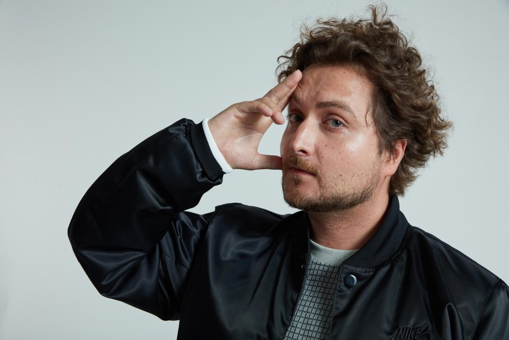 Man posing with hand on head