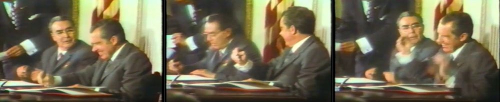 Leonid Brezhnev and Richard Nixon playfully signing an agreement in June 1973