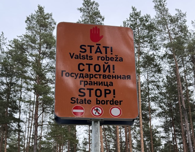 Warning sign in forest at border with Belarus near Daugavpils, Latvia.
