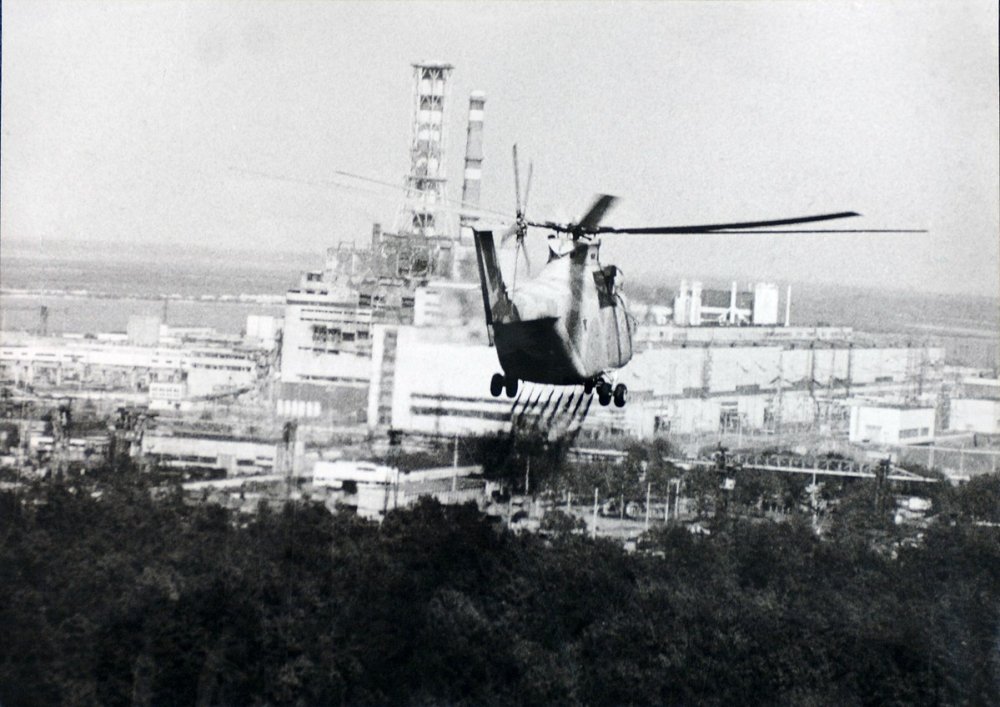 Helicopter spraying decontamination liquid over Chernobyl.