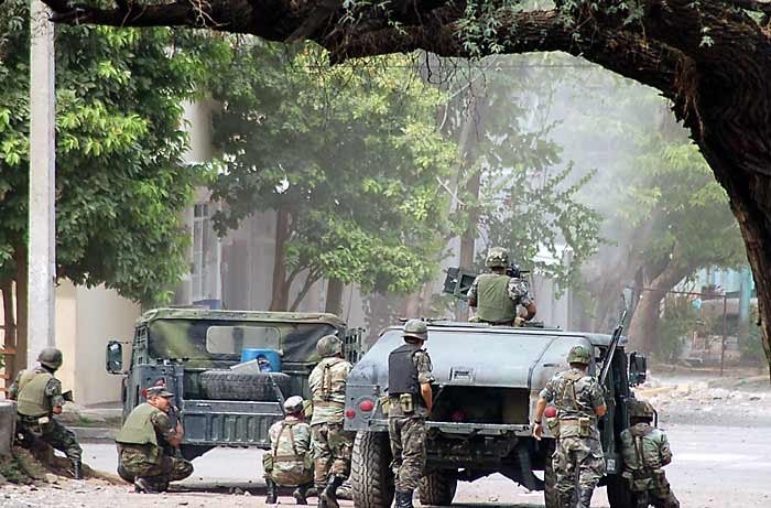 Soldiers huddled in Michoacan.