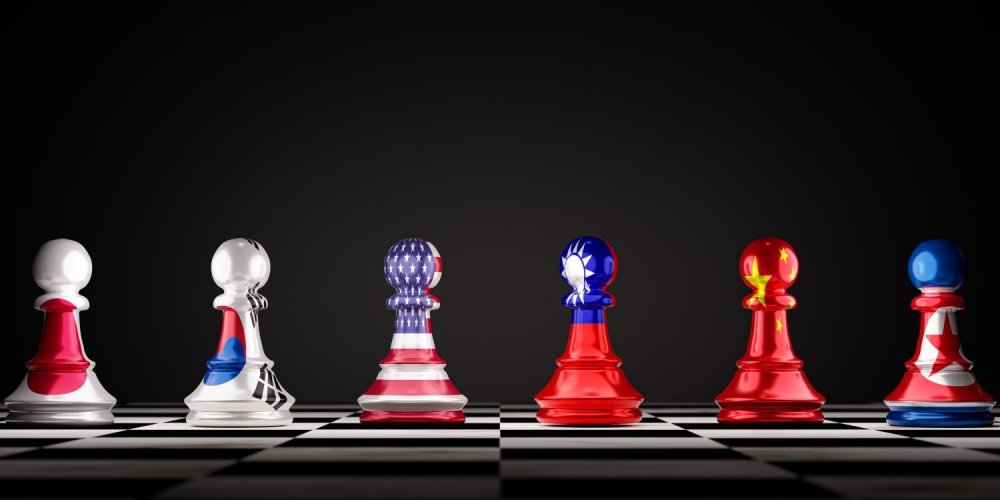 A set of chess pawns showing the flags of Japan, South Korea, The U.S., Taiwan, China, and North Korea