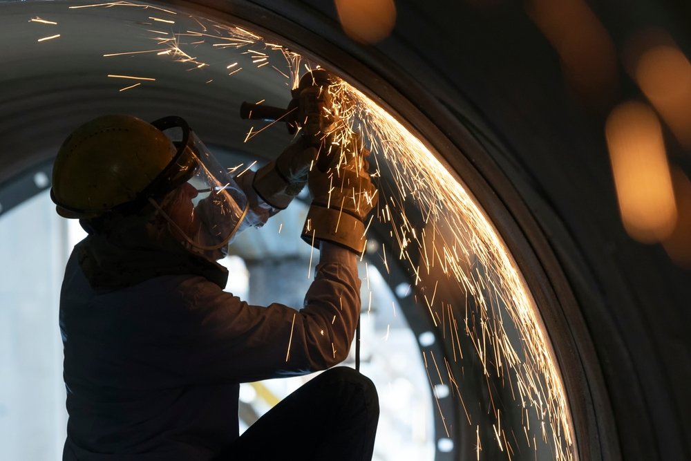 US Factory Worker Wielding Pipe