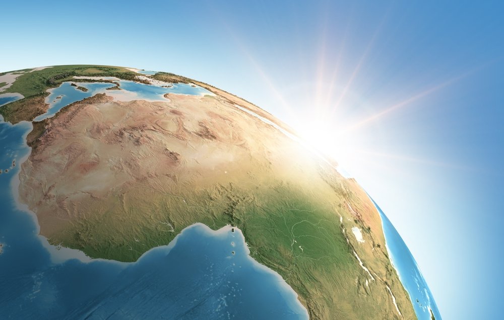 Sun shining over a high detailed view of Planet Earth, focused on Africa.