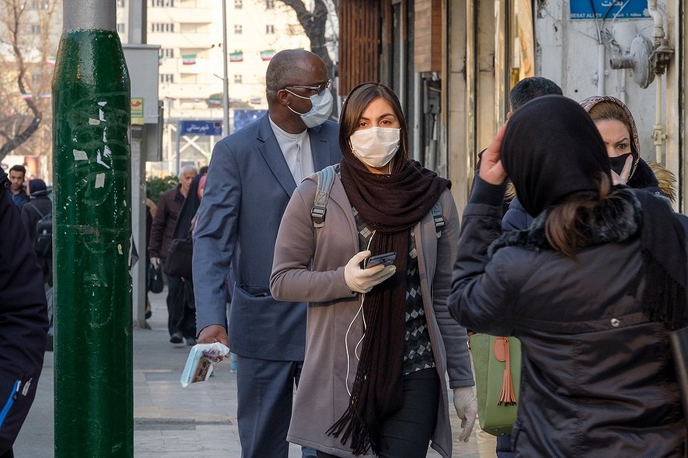 Pedestrians guarding against coronavirus in Iran