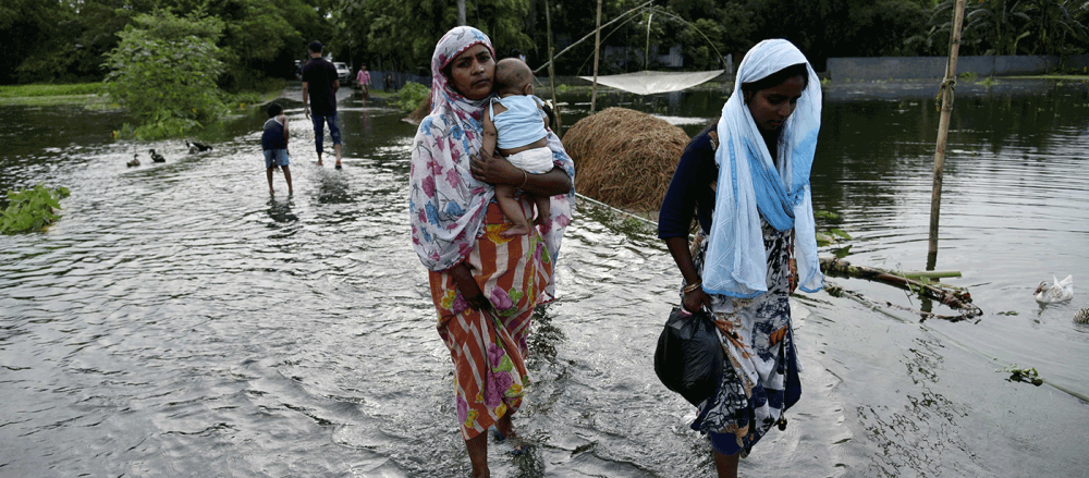 Women walking in flood