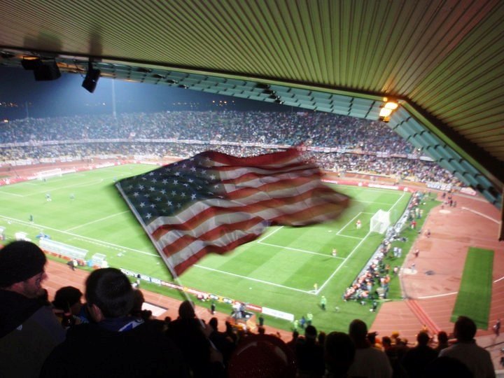 An American fan waves "Old Glory" at a 2010 World Cup soccer match