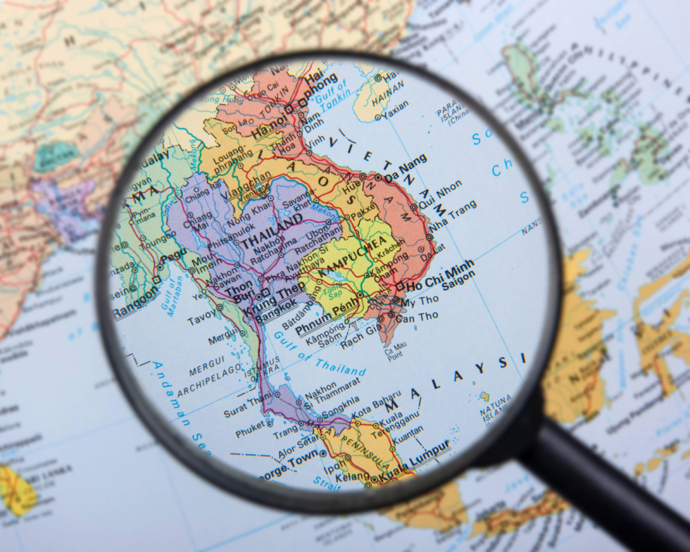 Magnifying glass over map of South East Asia