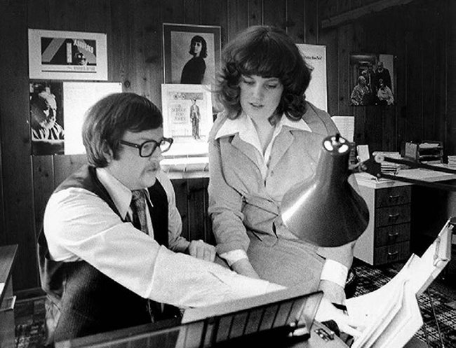 Black and White photo of man and woman in studio