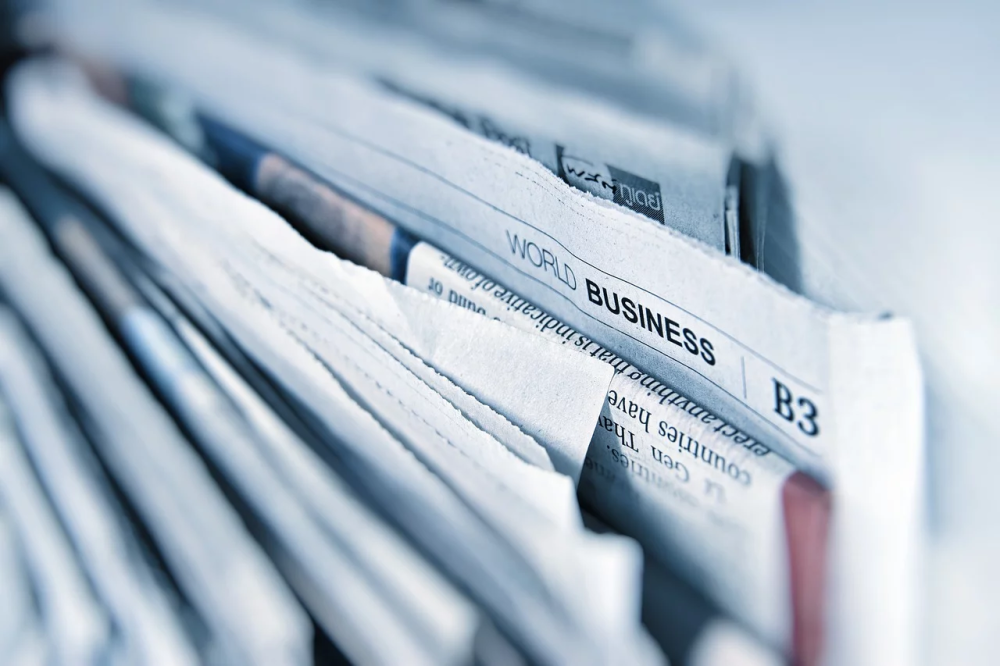 Stack of English Language Newspapers