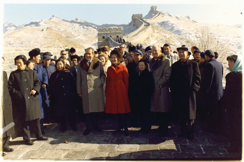 President Richard Nixon, Pat Nixon, William Rogers, Chinese officials, Pat Buchanan, White House Press Office photographer Oliver Atkins, Ron Walker, and entourage at the Ba Da Ling portion of the Great Wall.