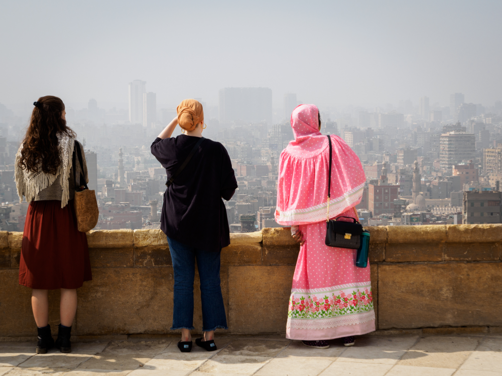 Cairo, Egypt, February 2020 three women overlooking the skyline of cairo