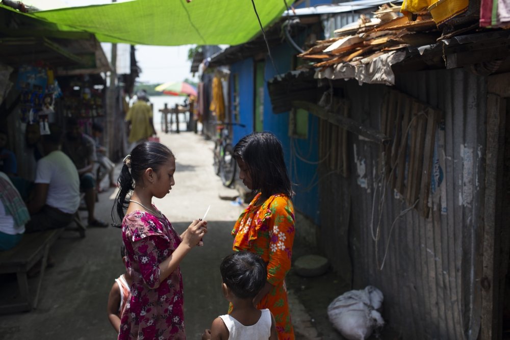 Bangladeshi children stand outside in Barisal.