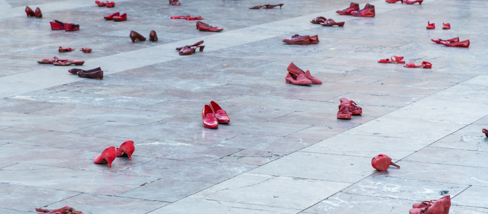 The Amnesty International event on the Plaza de la Virgen. Shoes, painted in red, spread out over the square. 