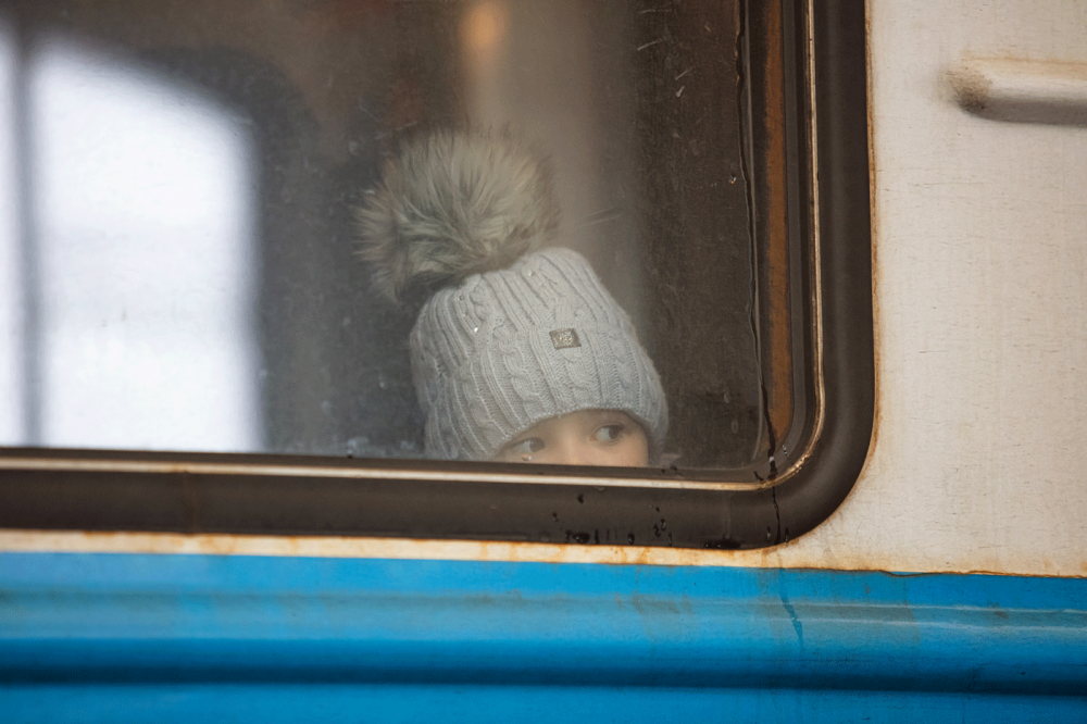 Lviv, Ukraine - March 7, 2022: Ukrainian refugees on Lviv railway station waiting for train to escape to Europe