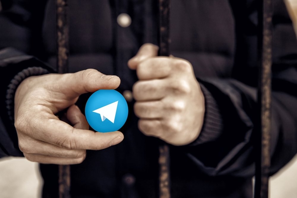 Man Holding Telegram logo