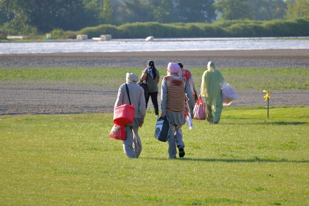 Canadian Sikhs walking in a field