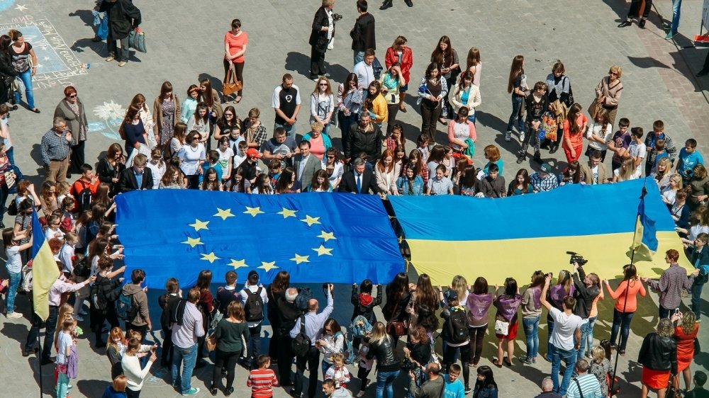 Crowd holding EU and Ukrainian Flag