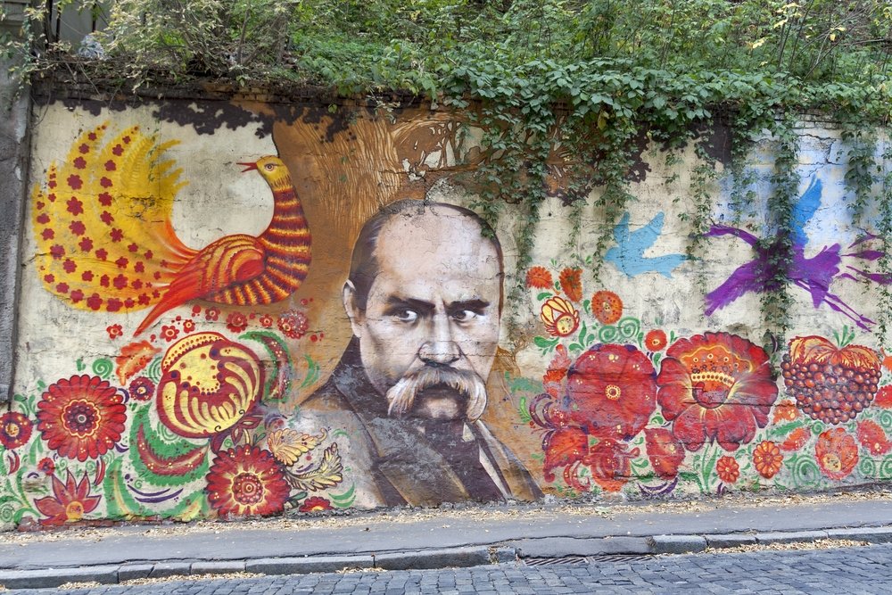 KHARKIV, UKRAINE - OCTOBER 4: City street Belgorod descent and wall graffiti with portrait of famous Ukrainian artist, writer and poet Taras Shevchenko (Kobzar) on October 4, 2012 in Kharkiv, Ukraine.