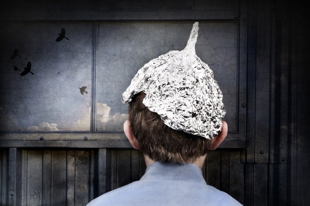 Young person wearing a tin foil hat