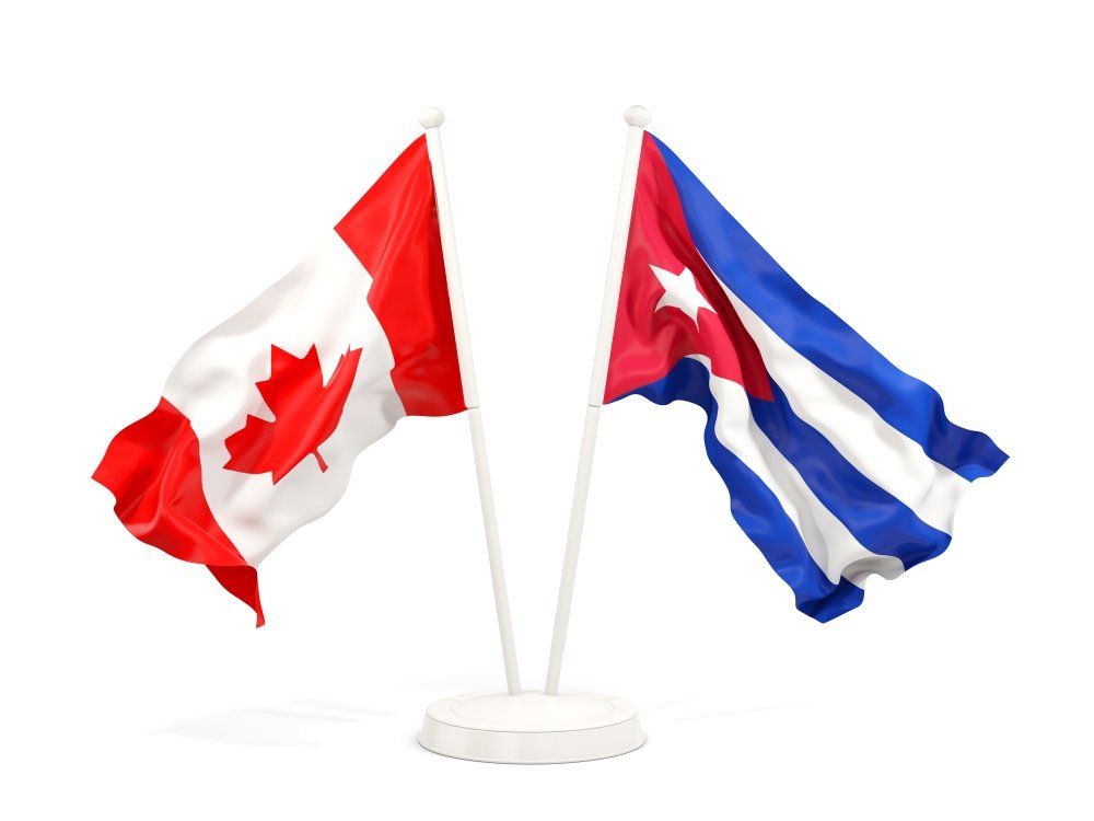 Two waving flags of Canada and cuba isolated on white