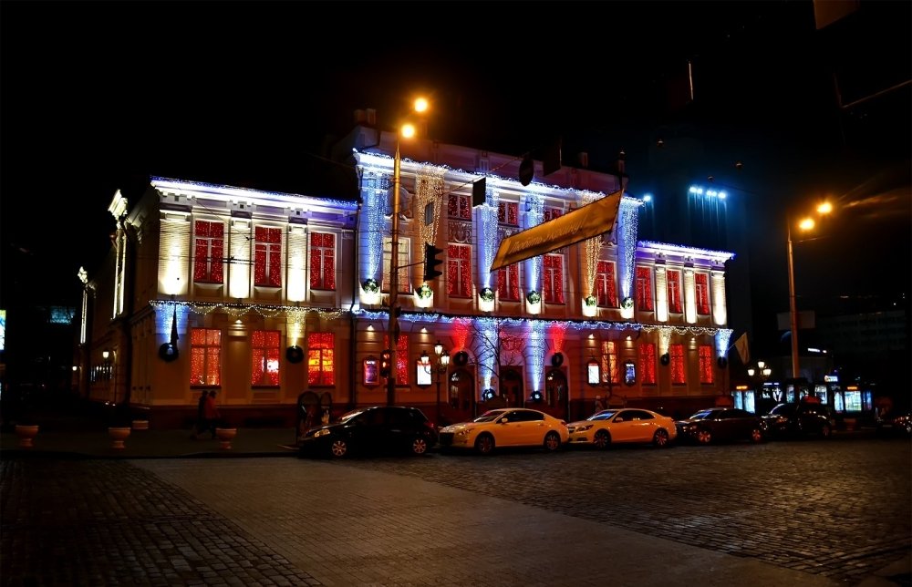 Kyiv theatre lit up at night