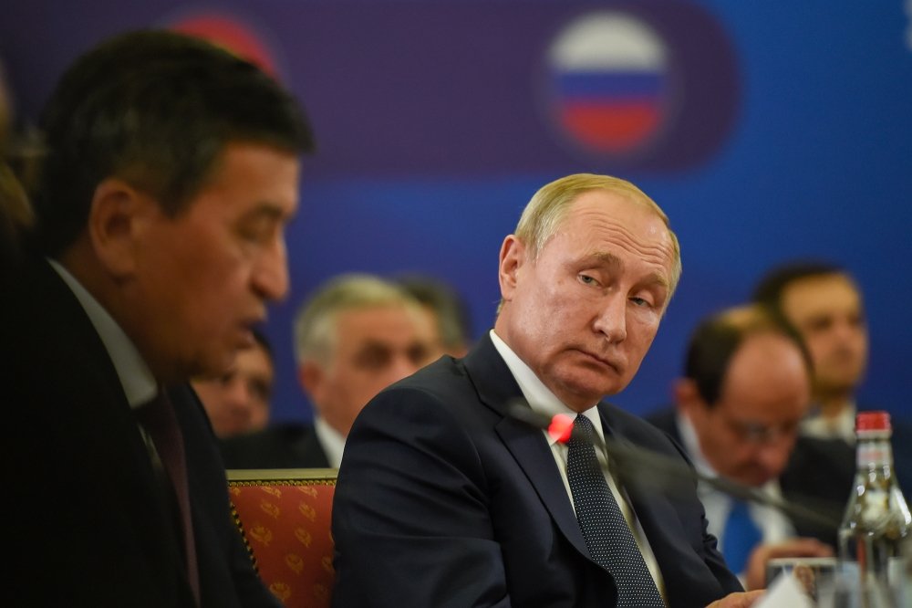 Russian President Vladimir Putin listen to president of Kyrgyzstan Sooronbay Jeenbekov during meeting of the Supreme Eurasian Economic Council in Yerevan, Armenia.