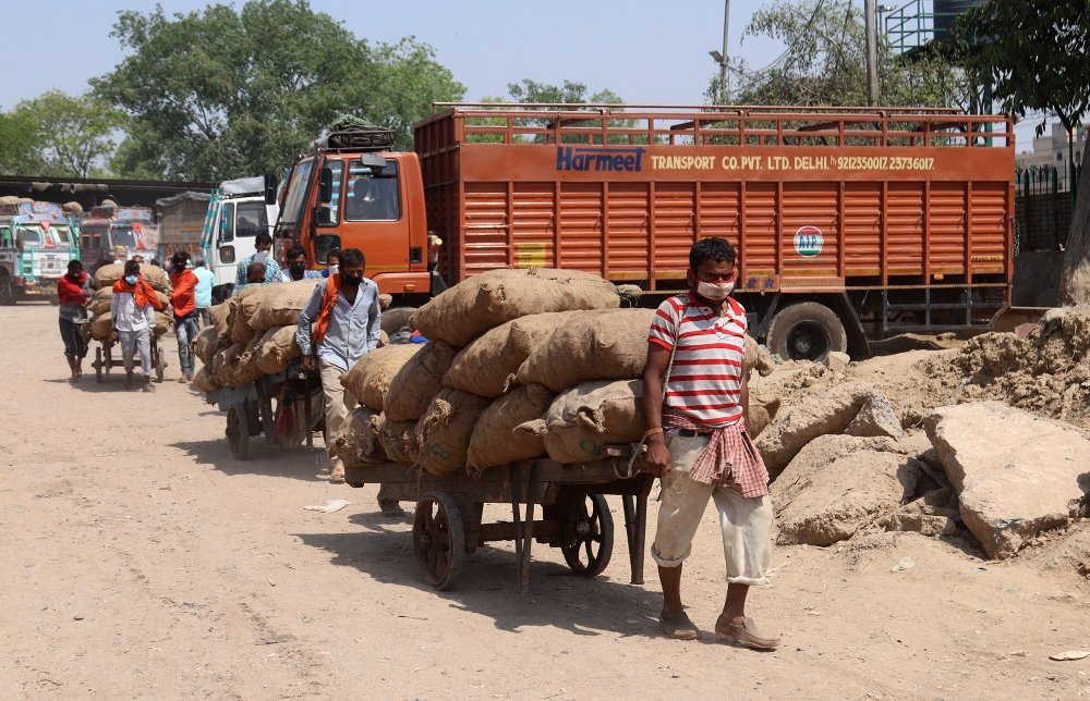 A Labor pull cart for selling at the wholesale fruit & vegetable market in New Delhi, India, during the lockdown to curb the spread of coronavirus