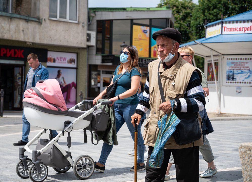 Quarantine in the city of Uzhhorod due to the COVID-19 virus. People in protective masks in the streets of the city