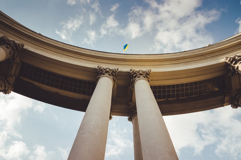 Portico of the building of the Ministry of Foreign Affairs. Ukraine flag flies on the arch of the Ministry of Foreign Affair. 