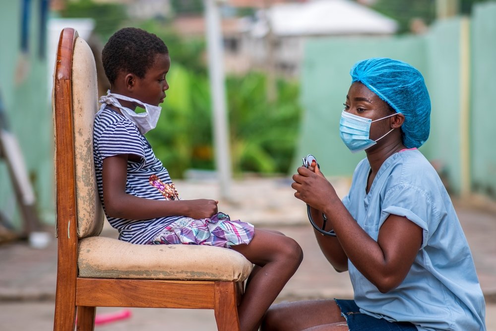 African Healthcare Worker and Child