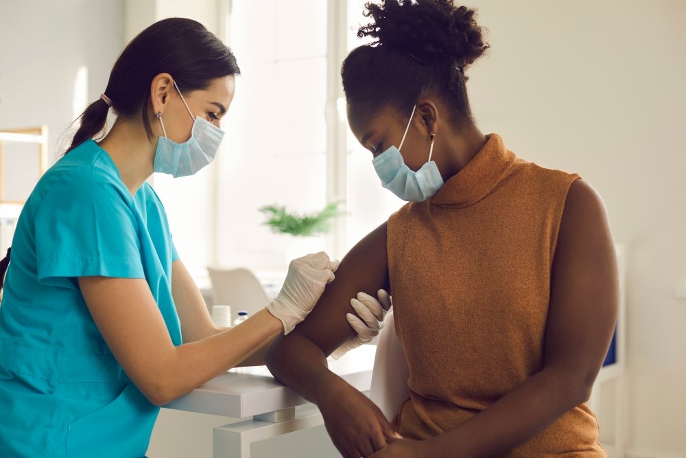 Woman receiving COVID-19 Vaccine