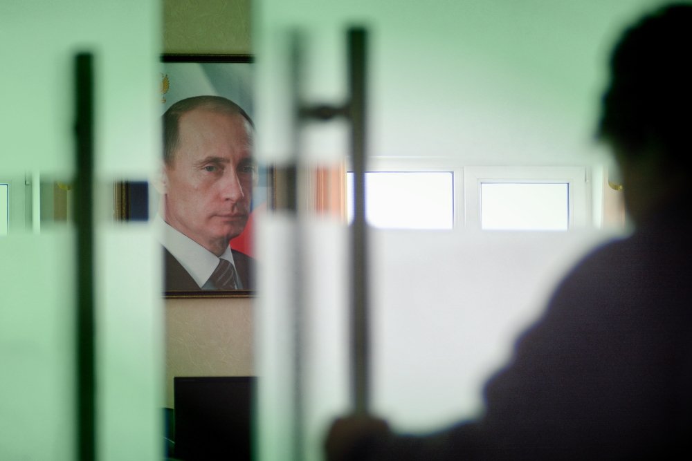 Moscow, Russia-September 24, 2019.A portrait of Vladimir Putin, the President of Russia, hangs on the wall in the room