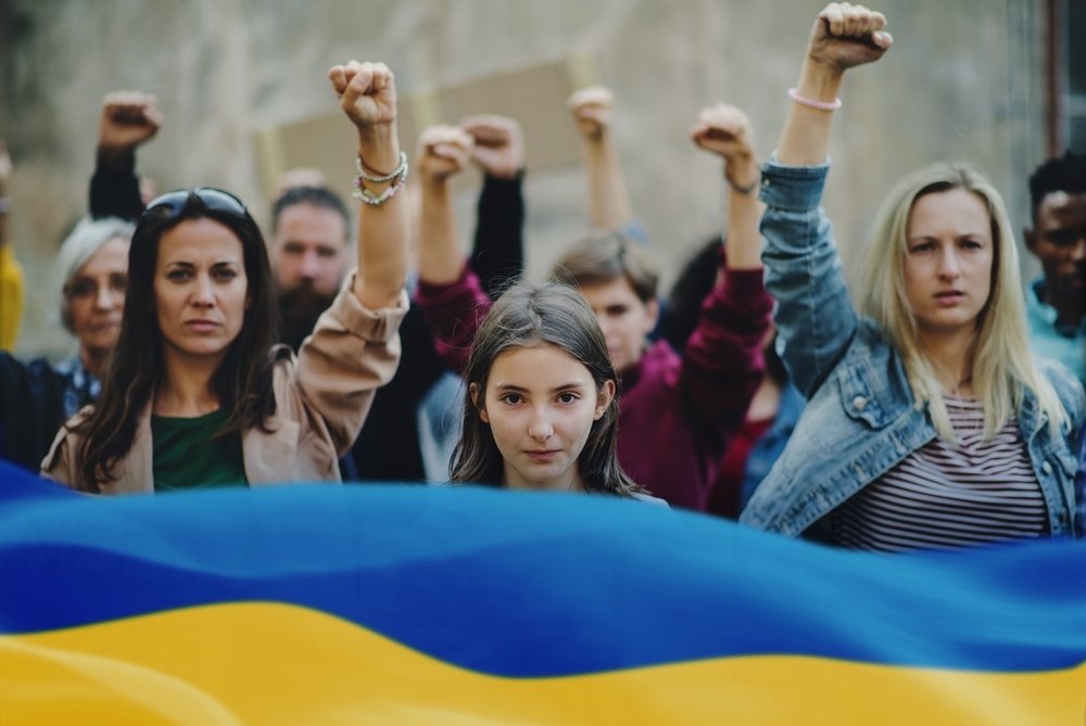 men with Ukrainian Flag
