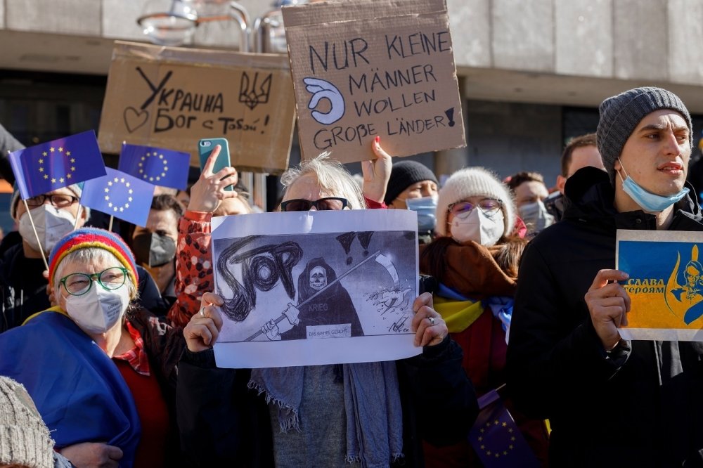 Group of protesters holding sign