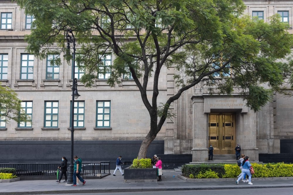 People walk in front of the National Supreme Court of Justice