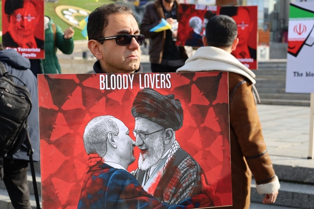 Kyiv, Ukraine - 28 October 2022: Iranian man with political banner in hands protests against dictatorship and ayatollah regime in Iran at street rally. reportage editorial photo