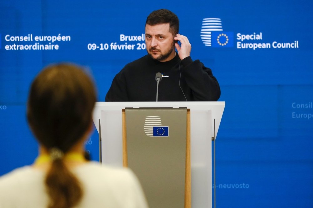 Zelenskyy on a podium at an event 