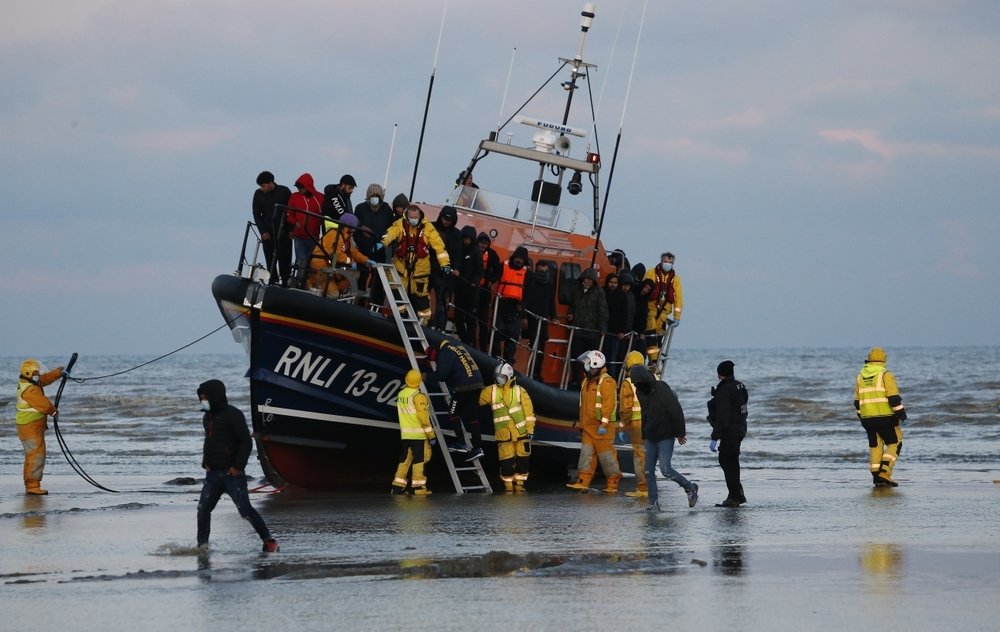 Migrants brought ashore after being rescued at sea by RNLI after travelling across the English Channel. 