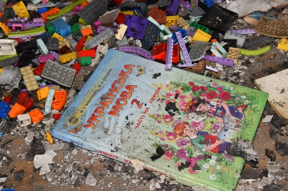 Ukrainian Children's Book on top of rubble