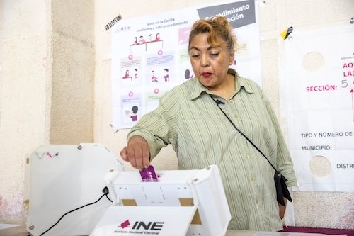 Woman Casting Ballot for Mexican Election
