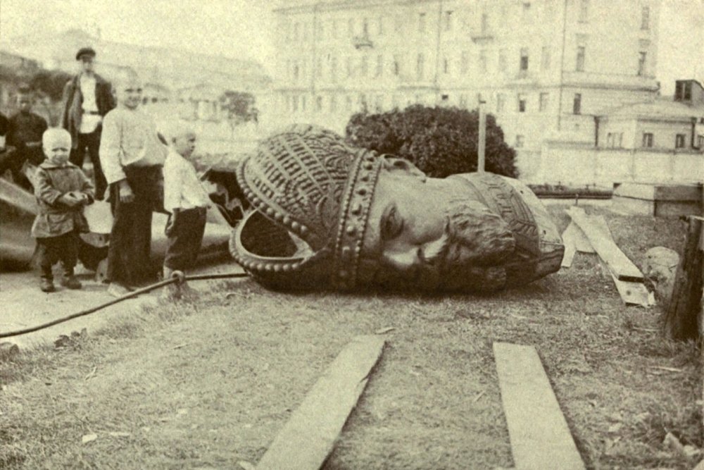 Historical photo of a toppled statue 