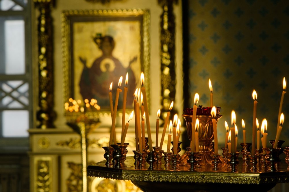 Candles are lit at an Orthodox Church