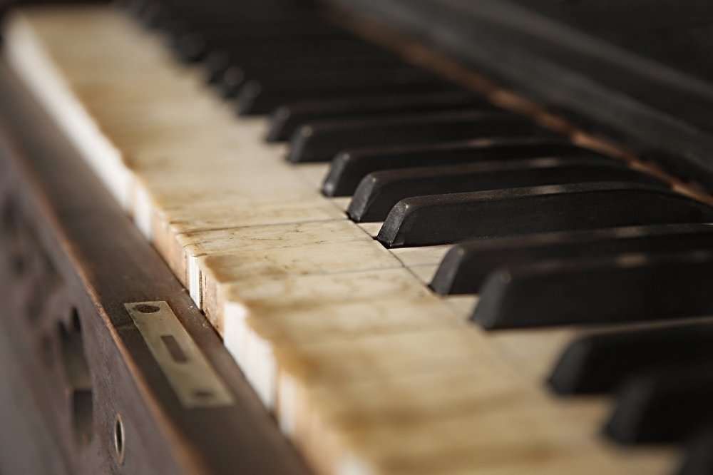 Old piano with faded keys