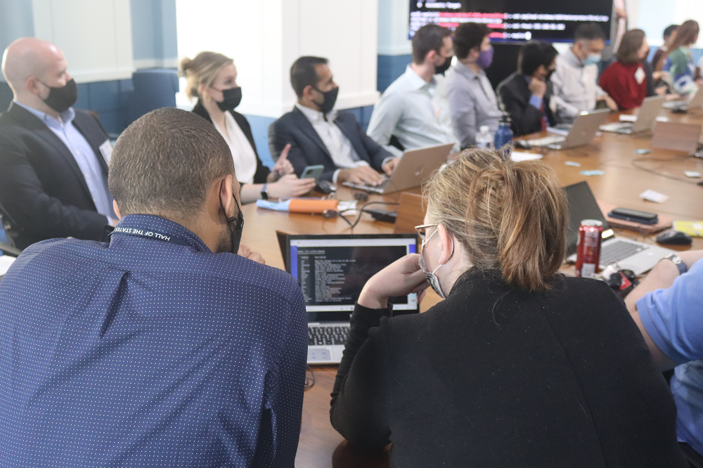 Two tech labs participants sharing a computer screen