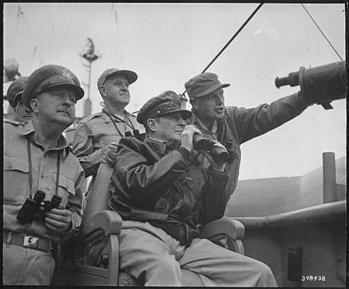 Generals Whitney, Macarthurt, and Almond observe the shelling of Inchon.