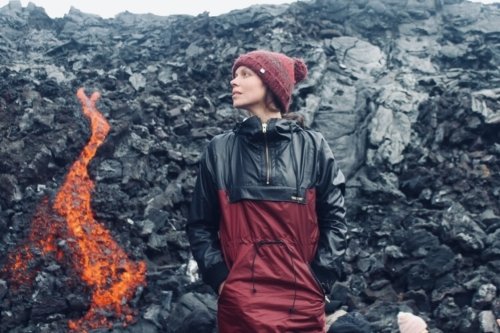 Person standing next to lava flow